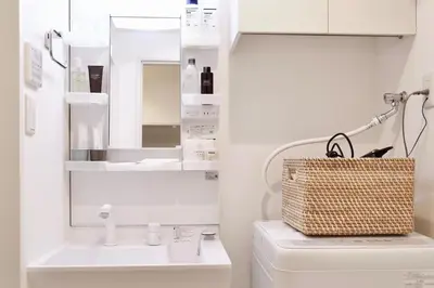 a bathroom with a sink and a mirror at 1001 Deluxe Double Room in Tokyo