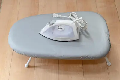 a white phone sitting on top of a chair at HOTEL Flag Tokyo in Tokyo