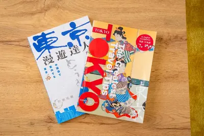 two tickets with illustrations on them on a table at HOTEL Flag Tokyo in Tokyo