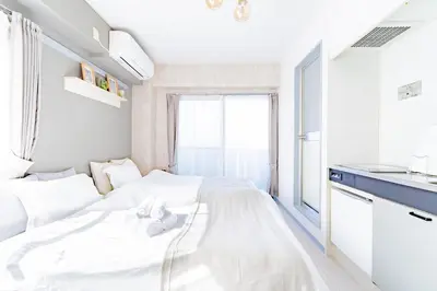 a white bedroom with a white bed and a window at FRt\u6075\u6bd4\u5bff2\u4e01\u76ee303 in Tokyo