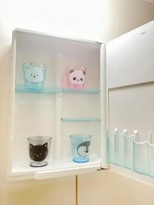 a white refrigerator with four different types of cats on shelves at Liberty Corp 102 - Vacation STAY 18545 in Tokyo