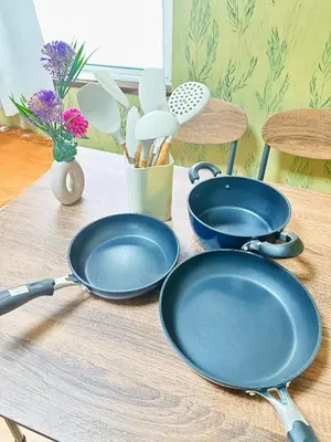 two blue frying pans sitting on a wooden table at Liberty Corp 102 - Vacation STAY 18545 in Tokyo