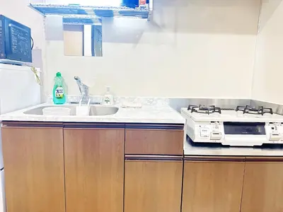 a kitchen with a sink and a microwave at Liberty Corp 102 - Vacation STAY 18545 in Tokyo