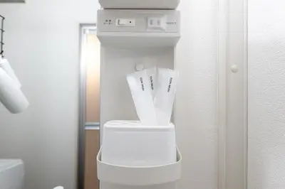 a white water dispenser sitting in a room at Stayloop\u5e73\u4e95 in Tokyo