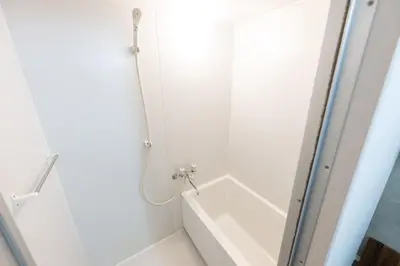a bathroom with a shower and a bath tub at Stayloop\u5e73\u4e95 in Tokyo