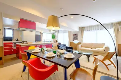 a kitchen and living room with a table and chairs at Penthouse Apartment with Skytree View - 94sqm Luxury Suite - Miilo ASAKUSA EAST in Tokyo
