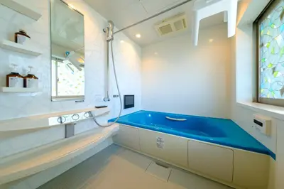 a bathroom with a blue tub and a sink at Penthouse Apartment with Skytree View - 94sqm Luxury Suite - Miilo ASAKUSA EAST in Tokyo