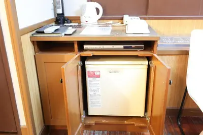 a washer and dryer under a counter in a room at HOTEL B-Girl in Tokyo