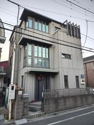 a large brick building on a city street at live in Onsen in Tokyo