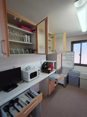 a kitchen with a counter with a microwave on it at live in Onsen in Tokyo