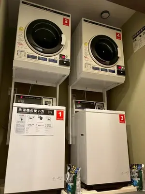 two washing machines and a refrigerator in a room at \u7537\u6027\u5c02\u7528-Male Only \u30b5\u30af\u30fc\u30ec\u516b\u5e83 in Tokyo