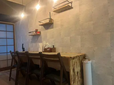 a dining room with a table and chairs at Doragon House in Tokyo