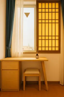 a desk in a room with a window at \u9752\u9ea6\u5bbf\u6cca \u65e9\u7a3b\u7530\u5e97 in Tokyo
