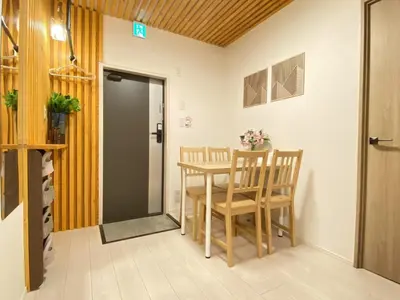 a dining room with a table and chairs at N5-Guest House in Tokyo ShinKoiwa in Tokyo