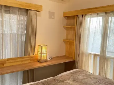 a bedroom with a bed and a window at N5-Guest House in Tokyo ShinKoiwa in Tokyo
