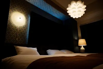a hotel room with two beds and two lights at Latte Urban Elegance Kinshicho, 5min walk to Station in Tokyo