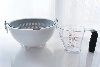 a whisk and a measuring cup on a counter at Latte Urban Elegance Kinshicho, 5min walk to Station in Tokyo