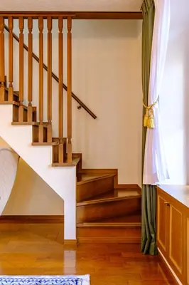 a living room with stairs and a window at Shibuya Urban Retreat - \u6771\u4eac\u89b3\u5149\u306b\u4fbf\u5229 - \u4ee3\u3005\u6728\u4e0a\u539f\u99c5\u304b\u3089\u5f92\u6b691\u5206 in Tokyo