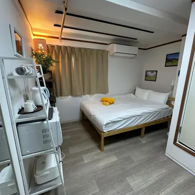 a small room with a bed and a window at Holiday Anytel Shinjuku#1 in Tokyo