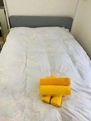 a pair of towels sitting on top of a bed at Holiday Anytel Shinjuku#1 in Tokyo