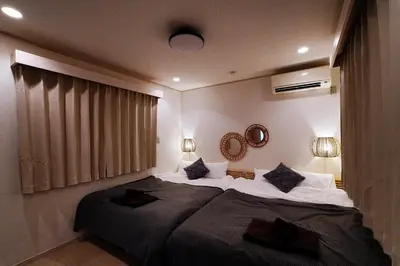 a bedroom with a large bed in a room at European villa in Tokyo