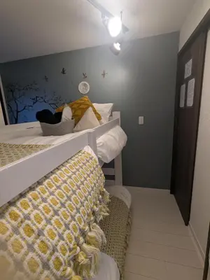 a room with two bunk beds in a room at Cozy stay with direct access to Narita & Haneda in Tokyo
