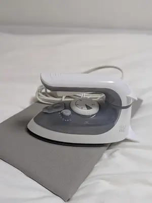 a toaster sitting on top of a bed at Cozy stay with direct access to Narita & Haneda in Tokyo