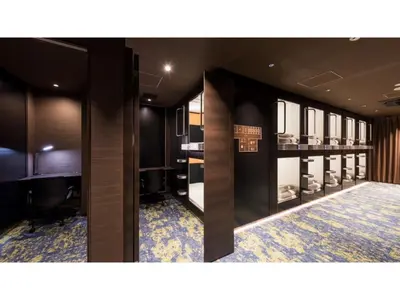 a dressing room with black walls and blue carpet at GLANSIT AKIHABARA