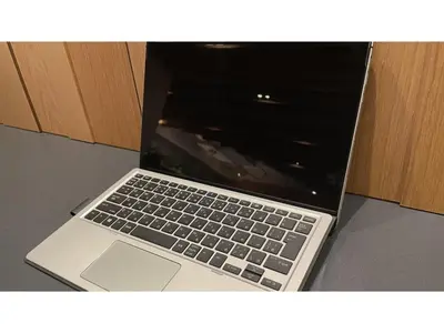 a laptop computer sitting on top of a table at GLANSIT AKIHABARA