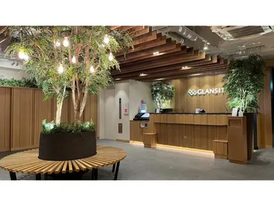 a lobby with a table with a tree in it at GLANSIT AKIHABARA