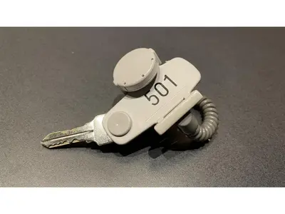 a close up of a car key with the word on it at GLANSIT AKIHABARA