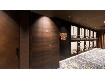 a dressing room with wooden doors and mirrors at GLANSIT AKIHABARA
