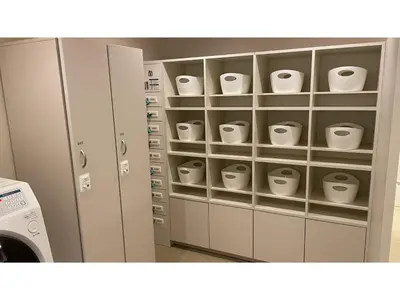 a room with a cupboard with cups in it at GLANSIT AKIHABARA