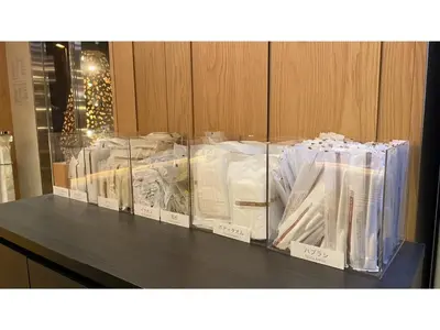 a display case filled with lots of white packages at GLANSIT AKIHABARA