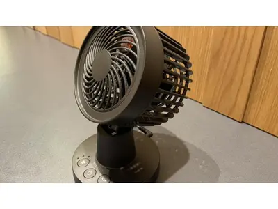 a black fan sitting on top of a table at GLANSIT AKIHABARA