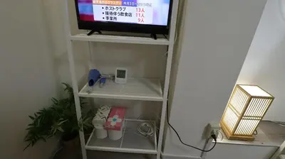 a tv sitting on a shelf in a room at Holiday Anytel Shinjuku#2 in Tokyo