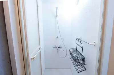 a bathroom with a shower with a walk in shower at Grass BLDG 301 in Tokyo