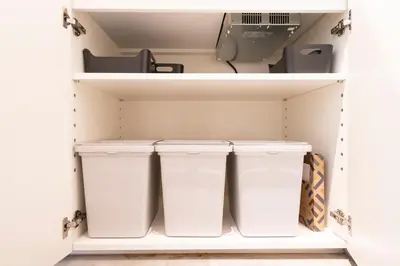 two white bins in a closet with a printer at Grass BLDG 301 in Tokyo