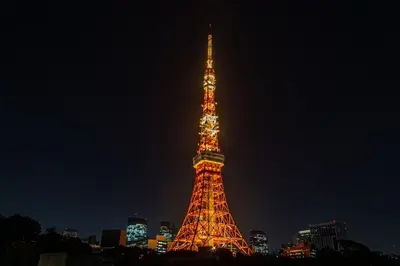 a lit up eiffel tower at night at Grass BLDG 301 in Tokyo