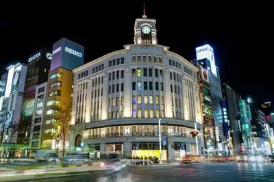 a large building with a clock tower on top of it at Grass BLDG 301 in Tokyo