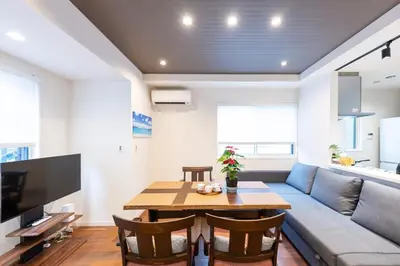 a living room with a couch and a table at Newly Built 3-Story House in the Heart of Tokyo-Easy Access to Airports,Skytree in Tokyo