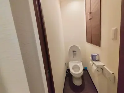 a small bathroom with a toilet in a stall at Asakusa Temple Detached BuildingZhujia Inn 2-8 people3 min walk to Asakusa Temple Skytree Ueno within walking distanceDirect access to Ginza, Shibuya, Shinjuku by subway in Tokyo