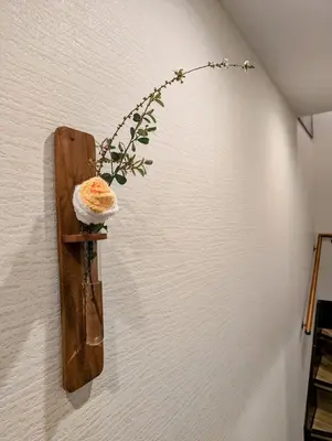 a plant in a bottle hanging on a wall at Asakusa Temple Detached BuildingZhujia Inn 2-8 people3 min walk to Asakusa Temple Skytree Ueno within walking distanceDirect access to Ginza, Shibuya, Shinjuku by subway in Tokyo