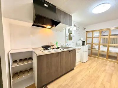 a kitchen with a sink and a stove top oven at Shinjuku Waseda\u30cf\u30a6\u30b9 T4 in Tokyo