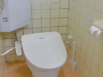 a bathroom with a white toilet in a room at Shinjuku Waseda\u30cf\u30a6\u30b9 T4 in Tokyo
