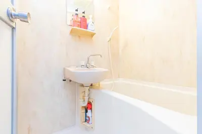 a bathroom with a sink and a bath tub at FRt\u6075\u6bd4\u5bff2\u4e01\u76ee305 in Tokyo