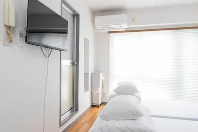 a row of beds in a hospital room at FRt\u6075\u6bd4\u5bff2\u4e01\u76ee305 in Tokyo