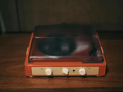 an orange toaster oven sitting on top of a table at illi Amu Shimokitazawa in Tokyo