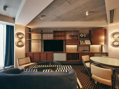 a living room with a couch and a tv at illi Amu Shimokitazawa in Tokyo