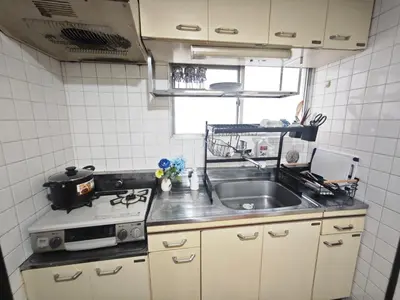 a kitchen with a sink and a stove at ZYZSumiyoshichō 2K SJ0254 in Tokyo